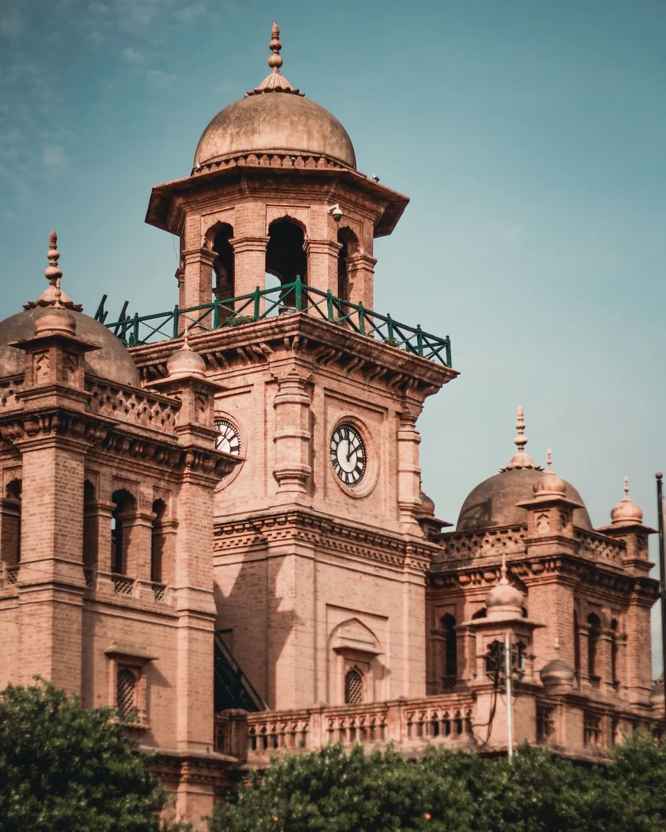 Historic clock tower and brick architecture at Islamia College in Peshawar